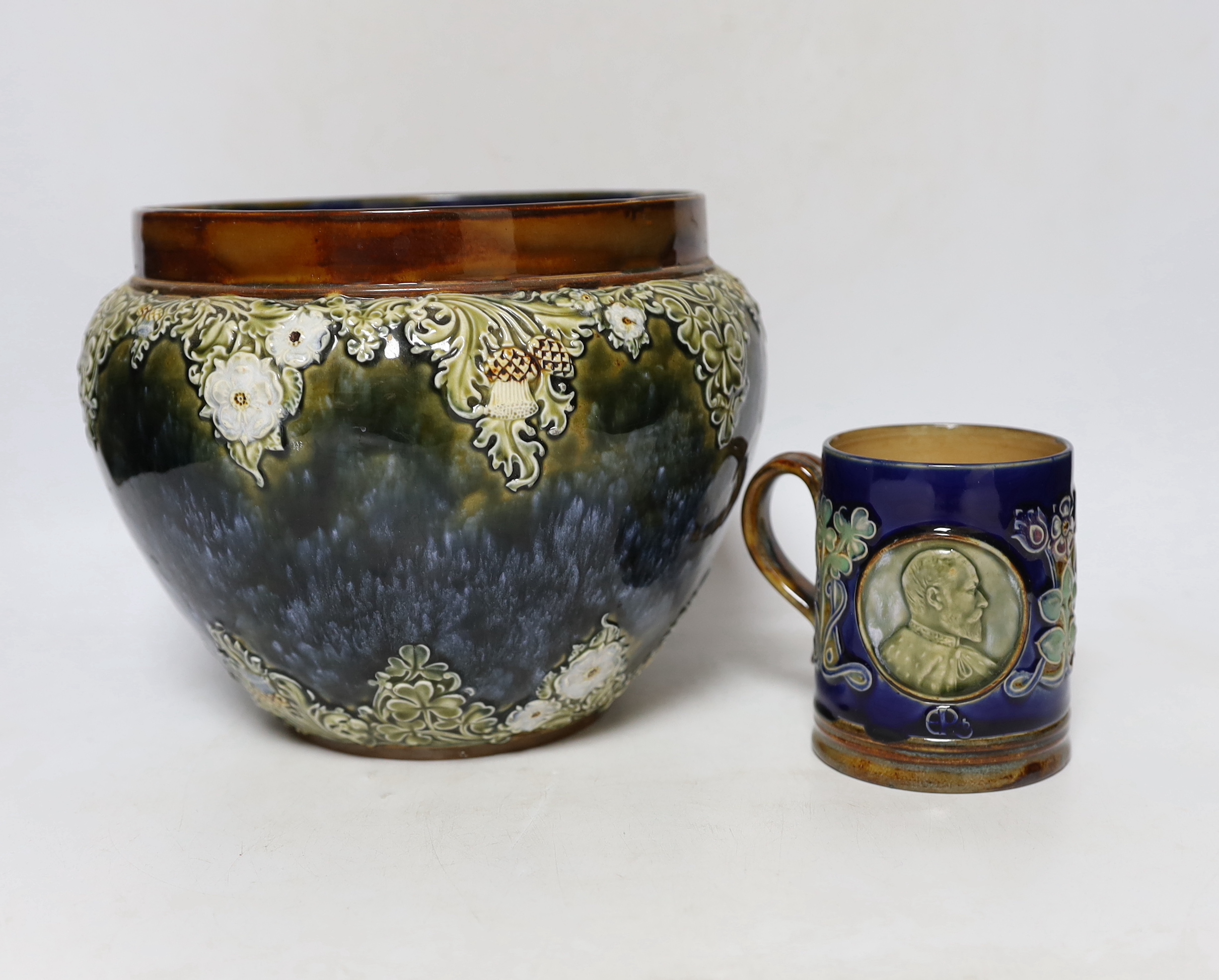 A Royal Doulton Lambeth Edward VII coronation mug and a Royal Doulton jardiniere, 18cm (2)